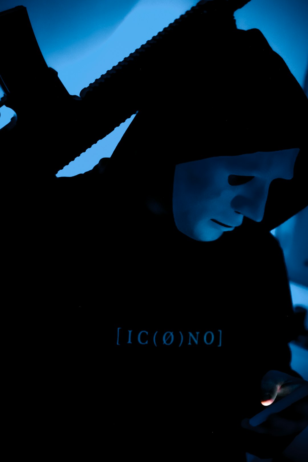 a-person-in-a-dark-room-using-a-cell-phone-wjq7p7rdnms